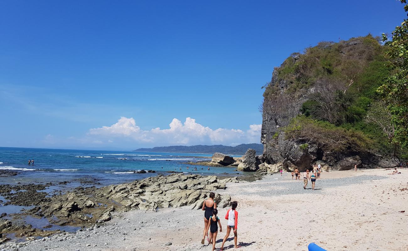 Foto af Playa Cuevas med lyst sand & sten overflade