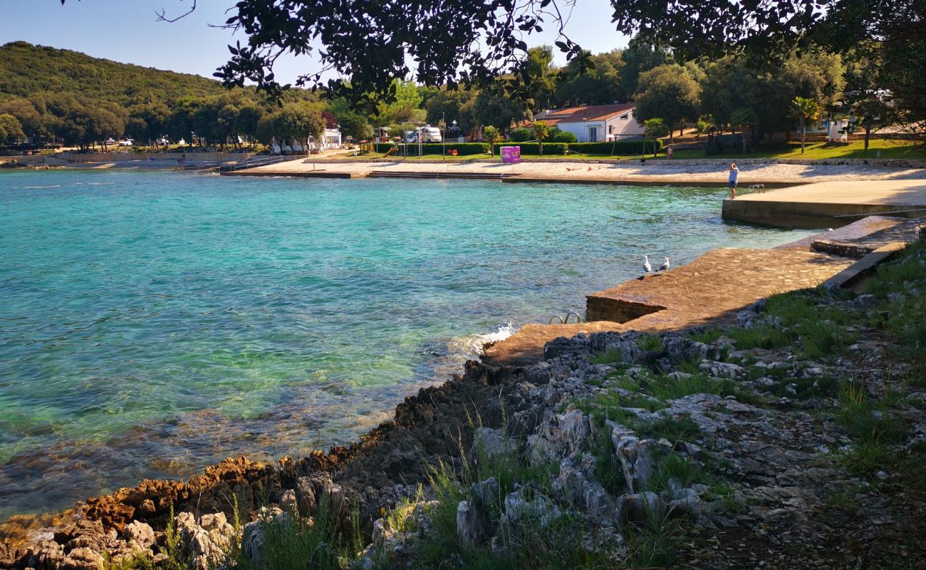 Foto af Porto Sole beach med betonovertræk overflade