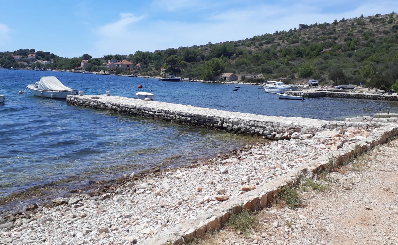 Foto af Porto Rosso beach med let fin sten overflade