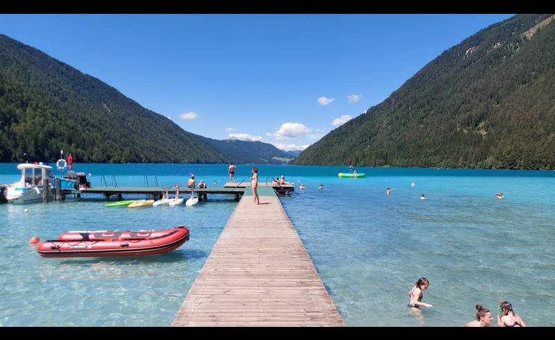 Foto af Freibad Weissensee med lys sand overflade