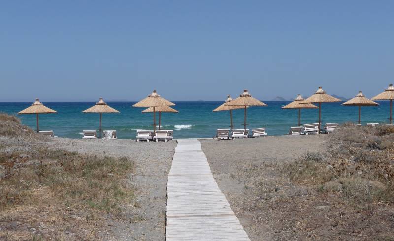 Foto af Blue lagoon beach med grå sand overflade