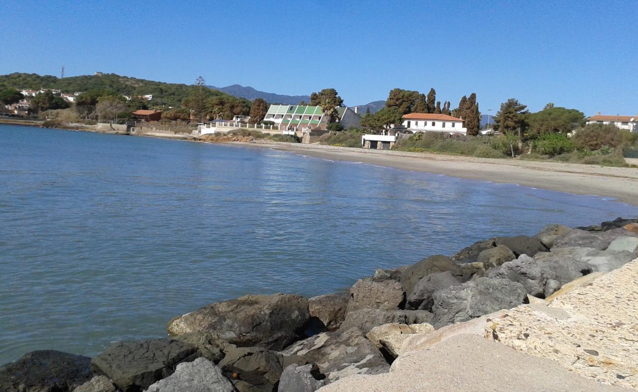 Foto af Porto Columbu II med let sand og småsten overflade