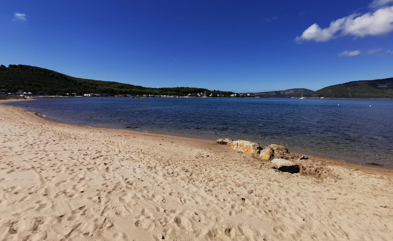 Foto af Porto Conte beach med lys sand overflade