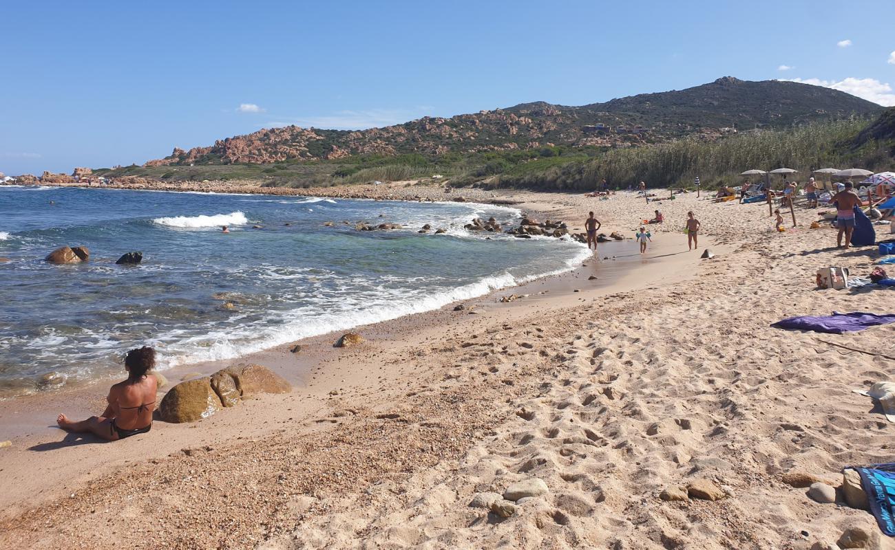 Foto af Spiaggia Li Caneddi med brunt sand og sten overflade