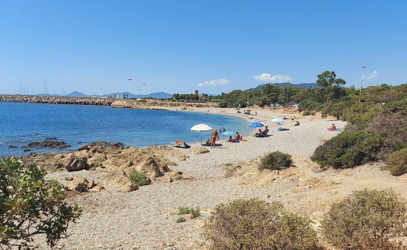 Foto af Spiaggia di Porto Corallino med let fin sten overflade