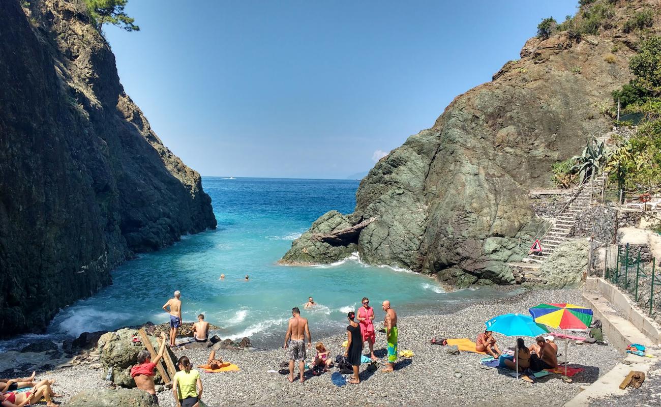 Foto af Spiaggia di Porto Pidocchio med grå sten overflade