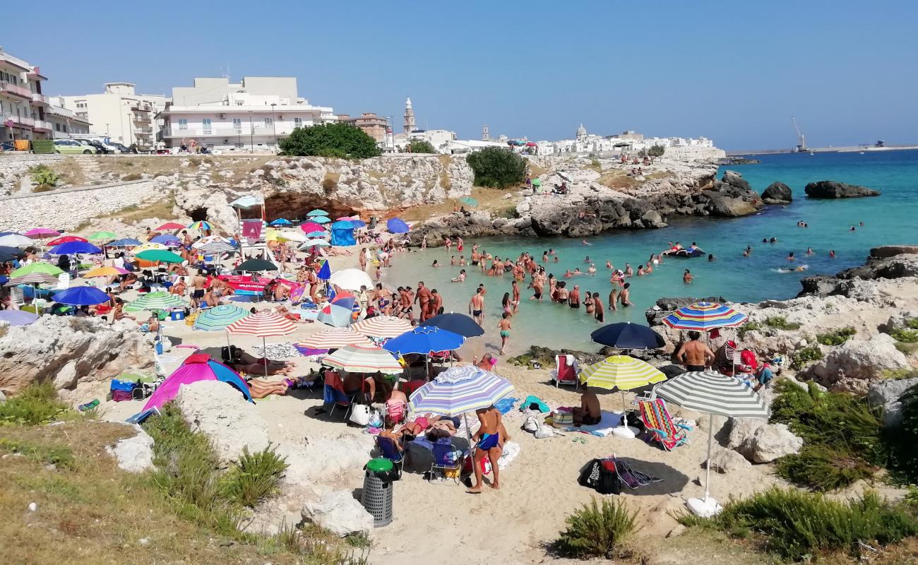 Foto af Spiaggia di Cala Porto Rosso med lys sand overflade