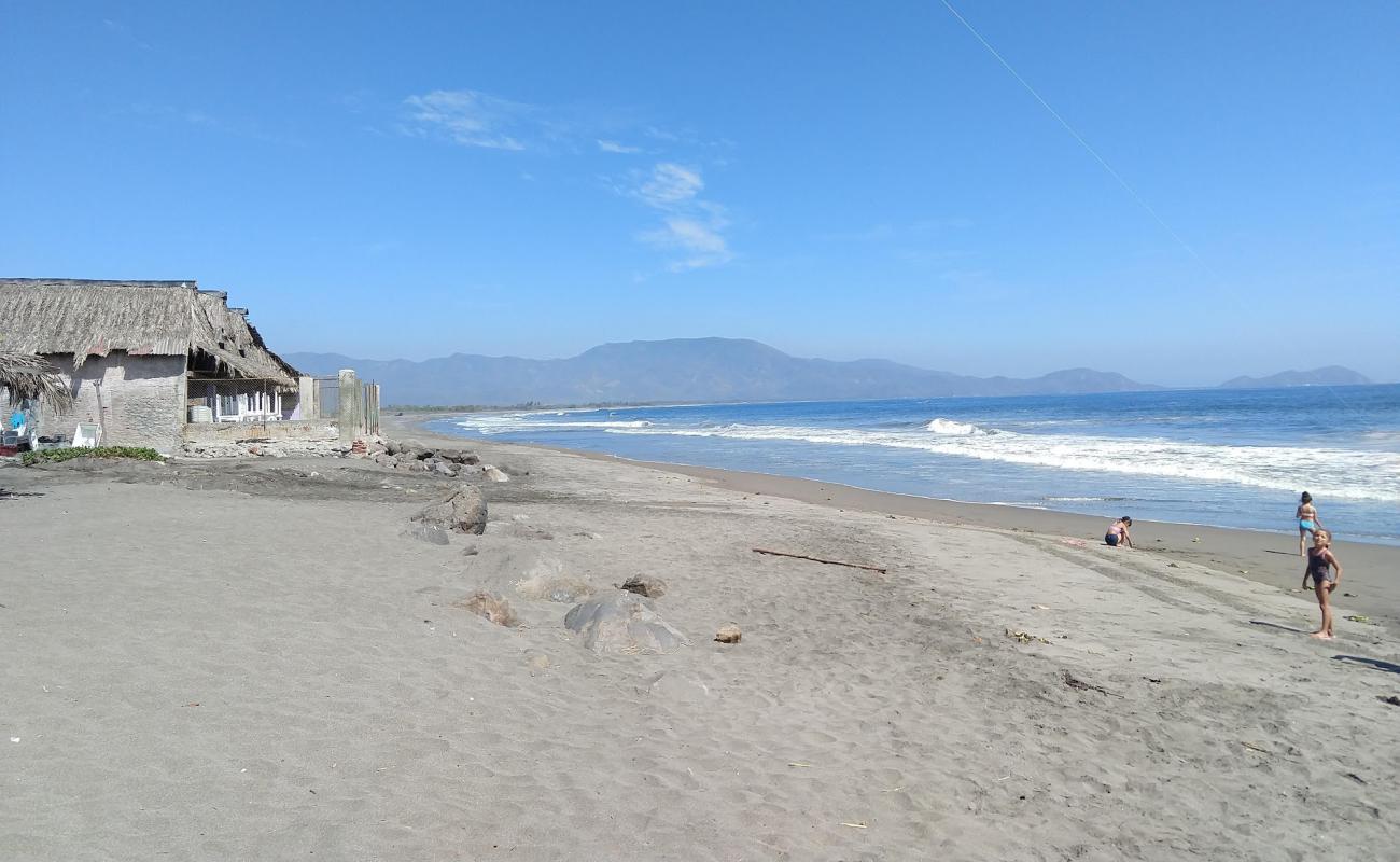 Foto af La Boca de Apiza Beach med fin brunt sand overflade