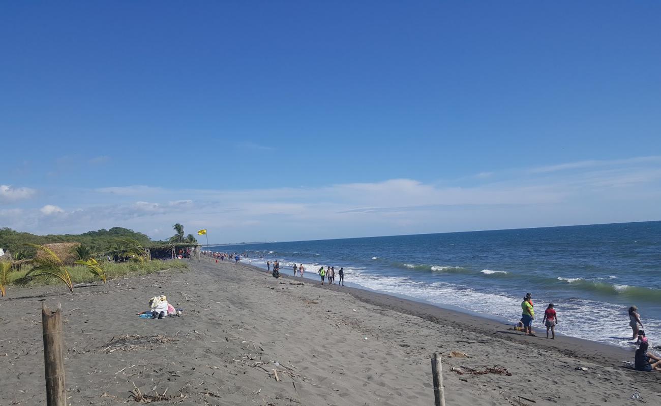 Foto af Playa de Estero Rico med brunt sand overflade