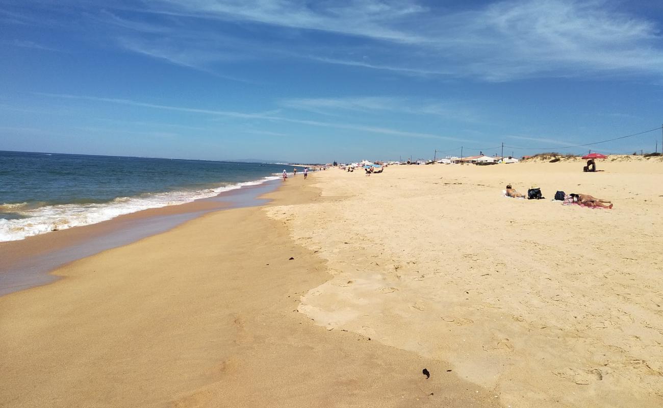 Foto af Faro Strand med fin brunt sand overflade