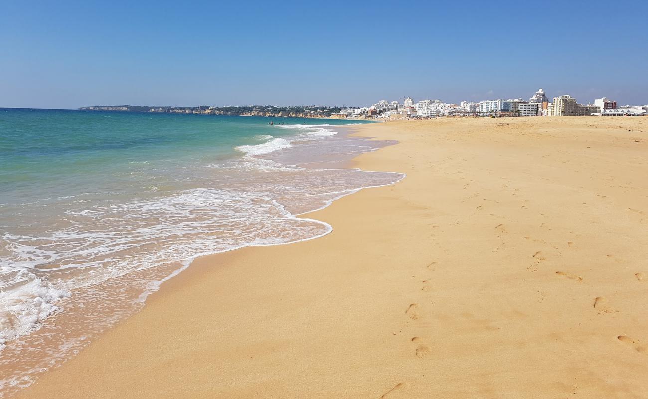 Foto af Armacao de Pera med fin brunt sand overflade