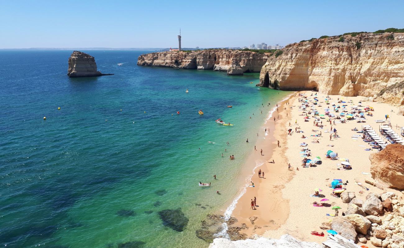 Foto af Praia dos Caneiros med fin brunt sand overflade