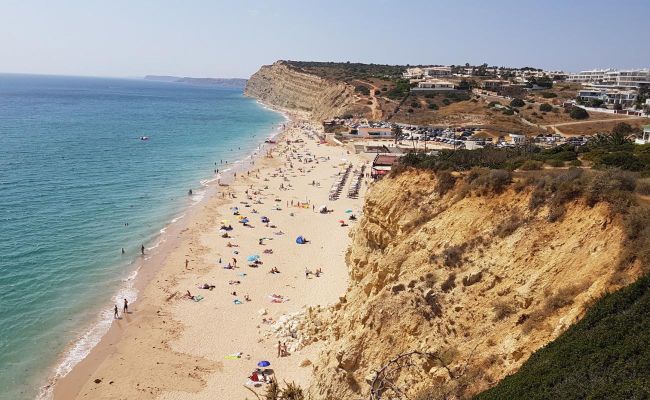 Foto af Praia de Porto de Mos med lys fint sand overflade