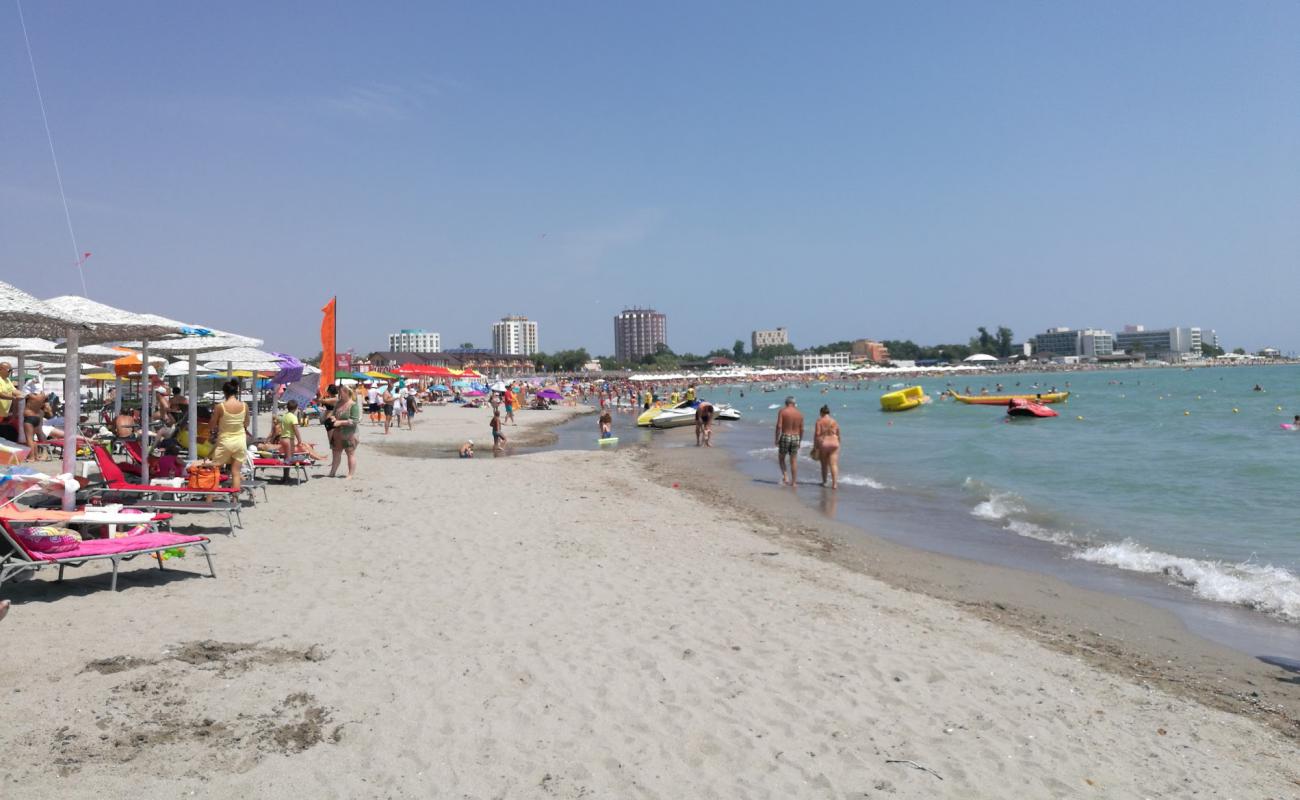 Foto af Venus II Strand med grå sand overflade