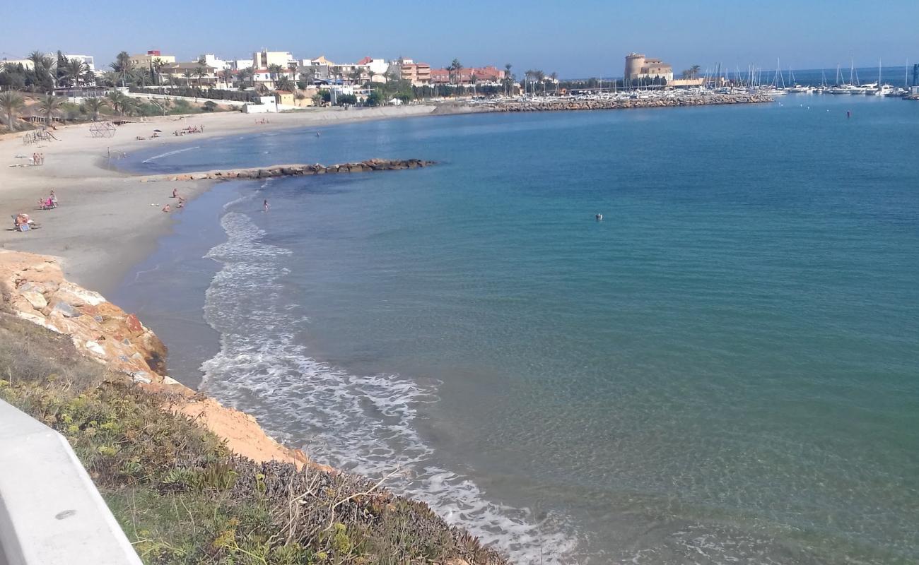 Foto af Playa del Puerto med lys sand overflade