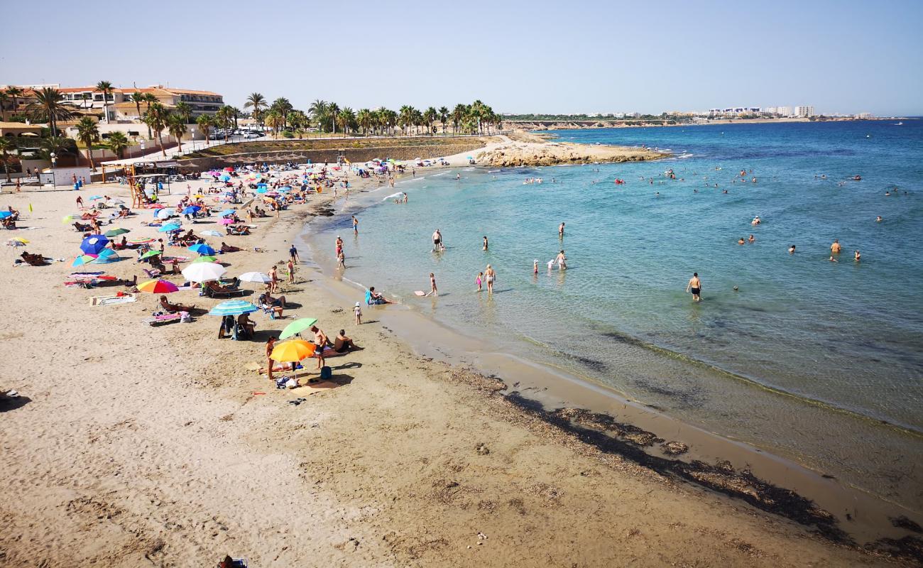 Foto af Flamenca Strand med brunt sand overflade