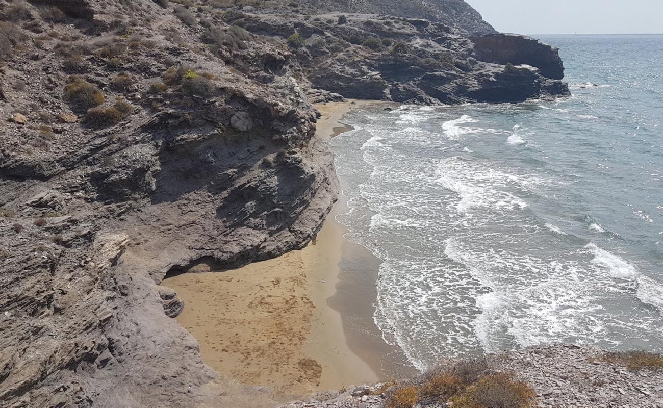 Foto af Cala de las Mulas med brunt sand overflade