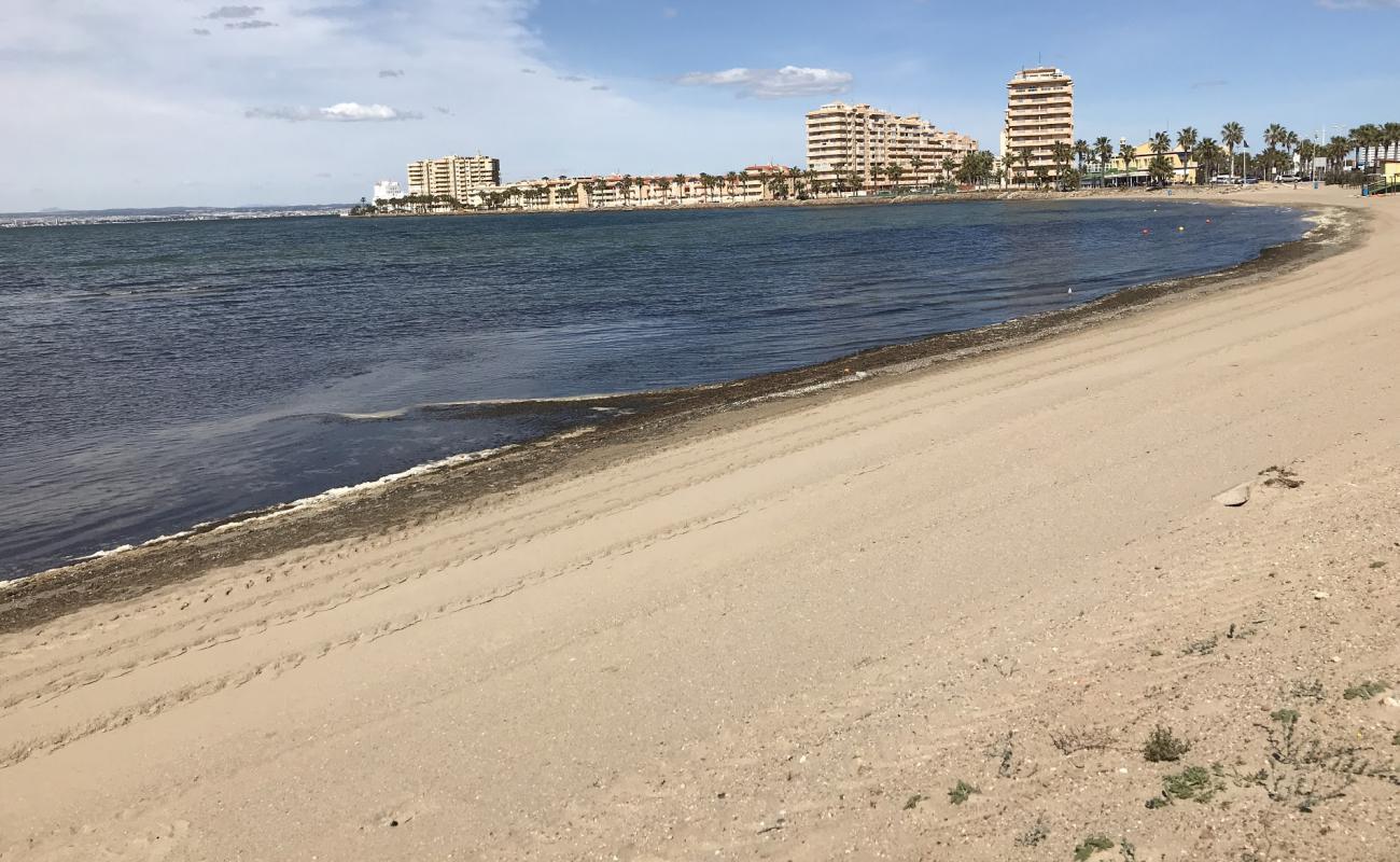 Foto af Playa Mistral med brunt sand overflade