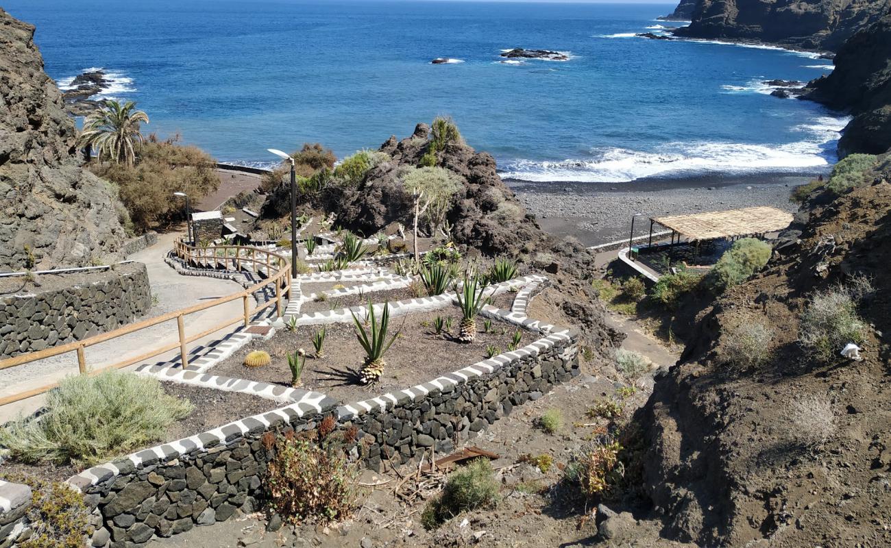 Foto af Playa de la Caleta med gråt sand og sten overflade