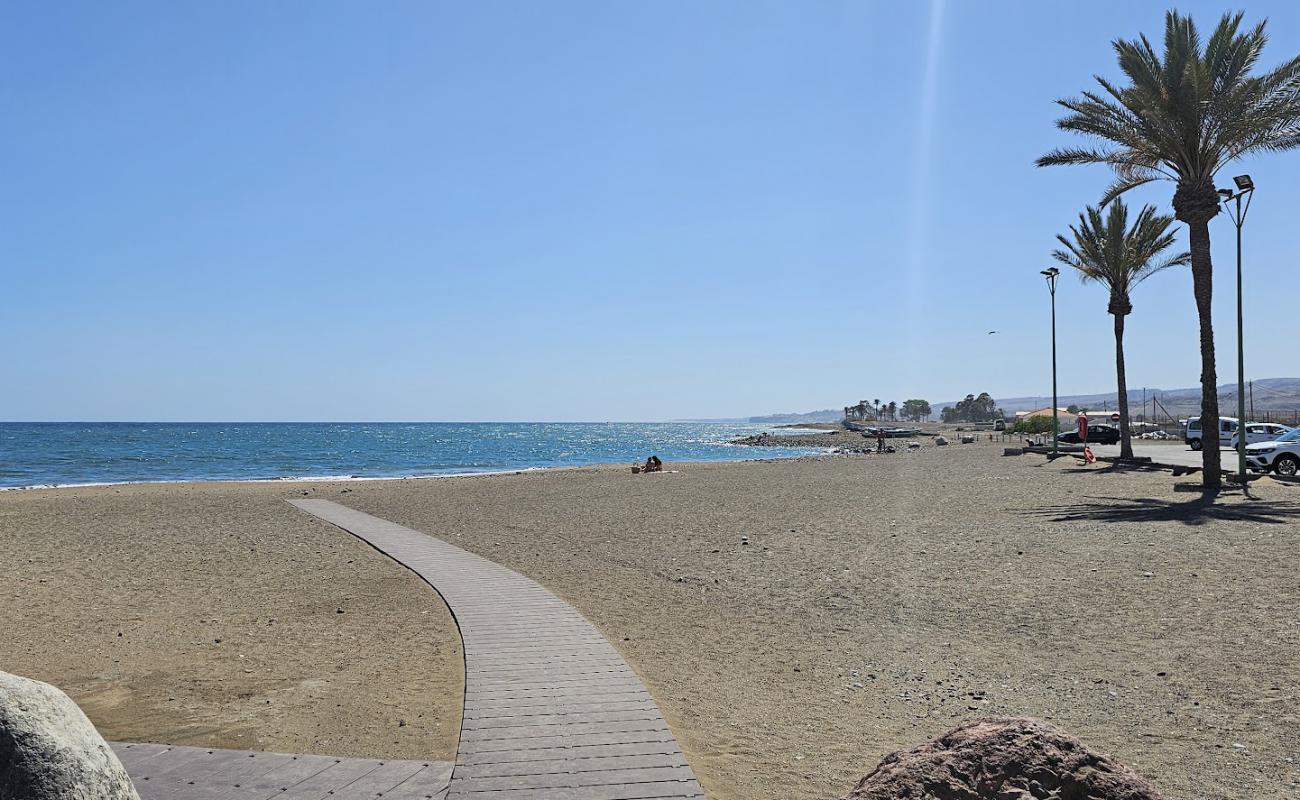 Foto af Playa La Caleta med grå sand overflade