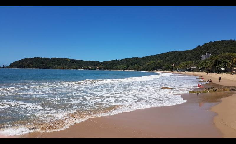 Foto af Grande Strand med lys sand overflade