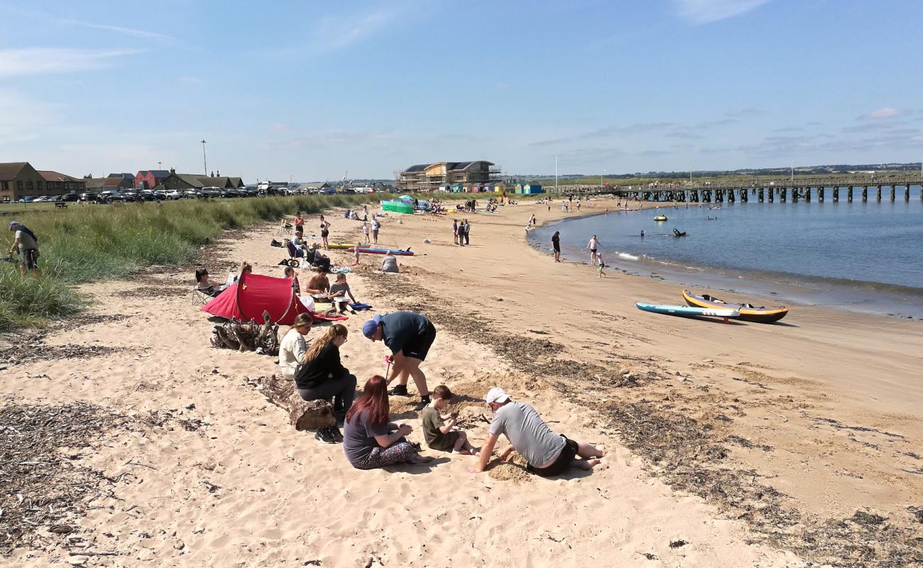 Foto af Amble Beach med lys sand overflade