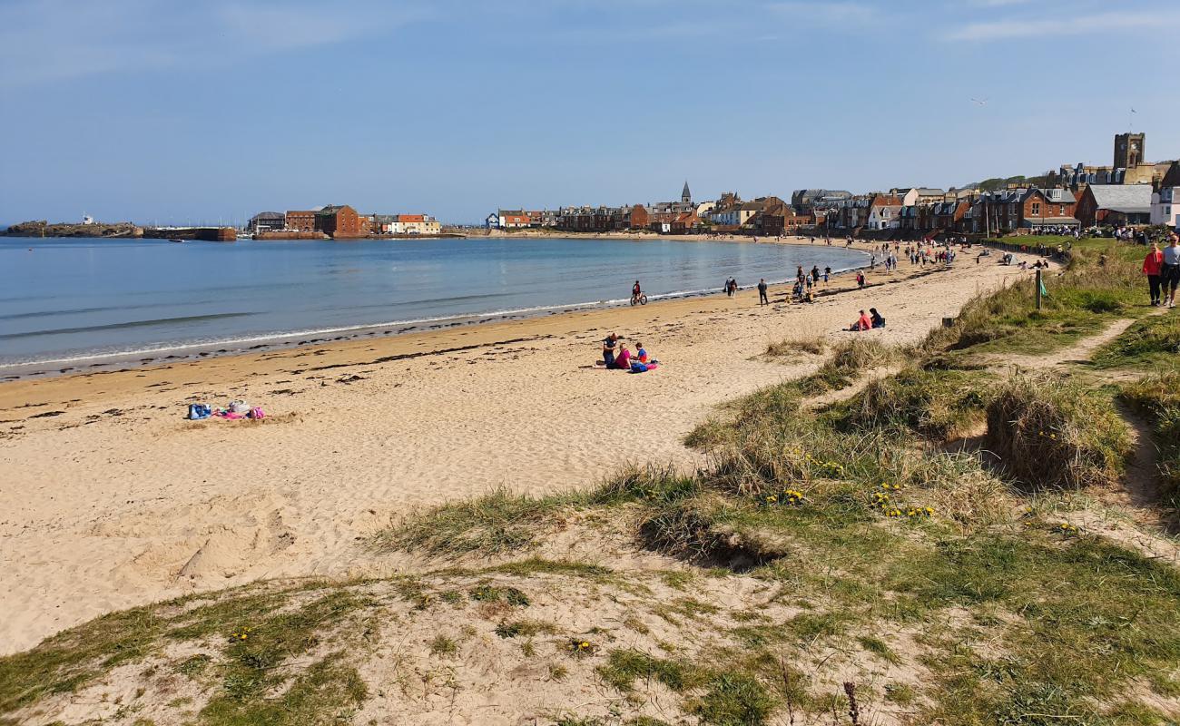 Foto af West Bay Beach med lys sand overflade