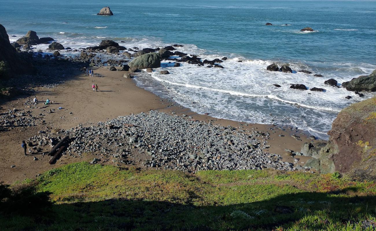 Foto af Mile Rock Beach med gråt sand og sten overflade