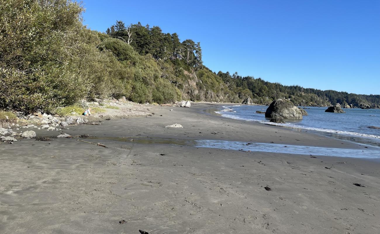 Foto af Old Home Beach med gråt sand og sten overflade